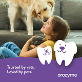 Girl with dog and cat on sofa, Text: Trusted by vets. Loved by pets. orozymes.