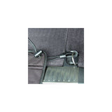 Close-up of a fastening system with elastic band, plastic clasp and metal hook on a black fabric base.