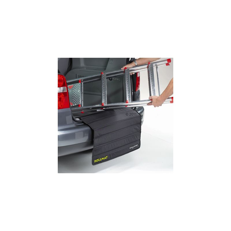Black roll mat with yellow 'ROLLMAT' lettering protects a car bumper when loading with a ladder.