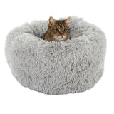 Grey, round cat bed made of fluffy material with a cat inside.