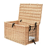 Open basket made of woven rattan with metal grid on the side and black fasteners. Ideal for storage or transport.
