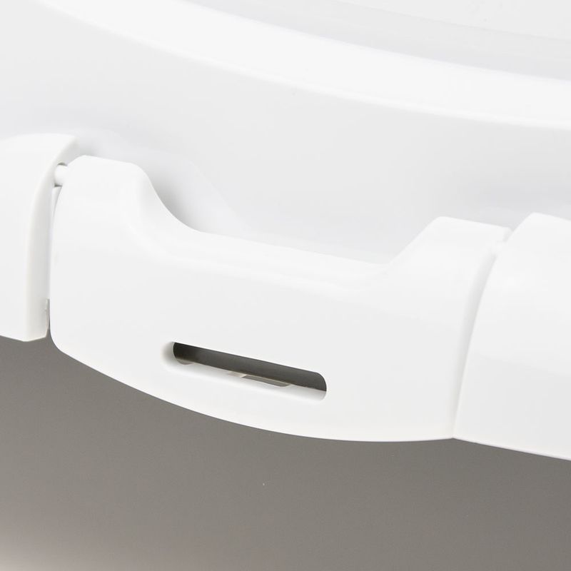 Close-up of a white locking mechanism, suitable for containers or boxes.