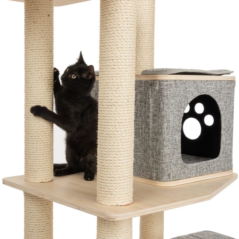Cat tree with sisal-wrapped posts, wooden platforms, and grey cave with paw pattern. Black cat using scratching post.