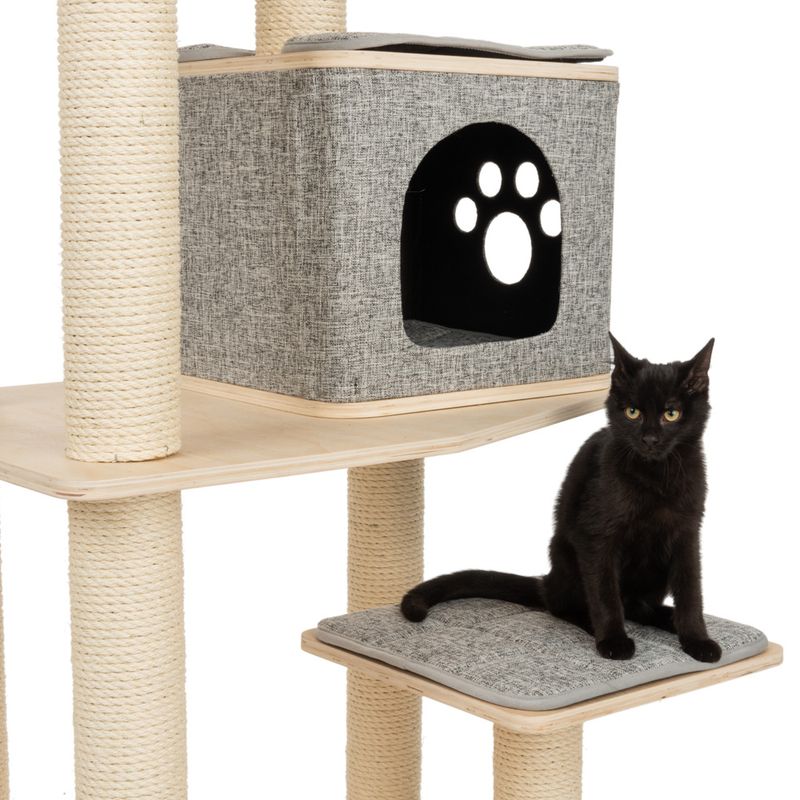 Cat tree with sisal posts, grey cave with paw motif and padded lying surface. Black cat sitting on the lower platform.