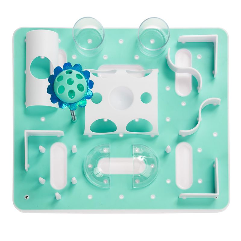 Interactive game board with various white and transparent elements on a mint green base, including a blue flower with holes for activity games.