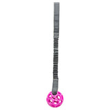 Toy with grey elastic band and pink plastic ball with honeycomb structure.