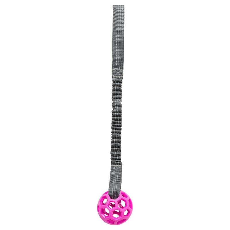 Toy with grey elastic band and pink plastic ball with honeycomb structure.