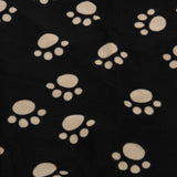 Black fabric with beige paw print pattern.