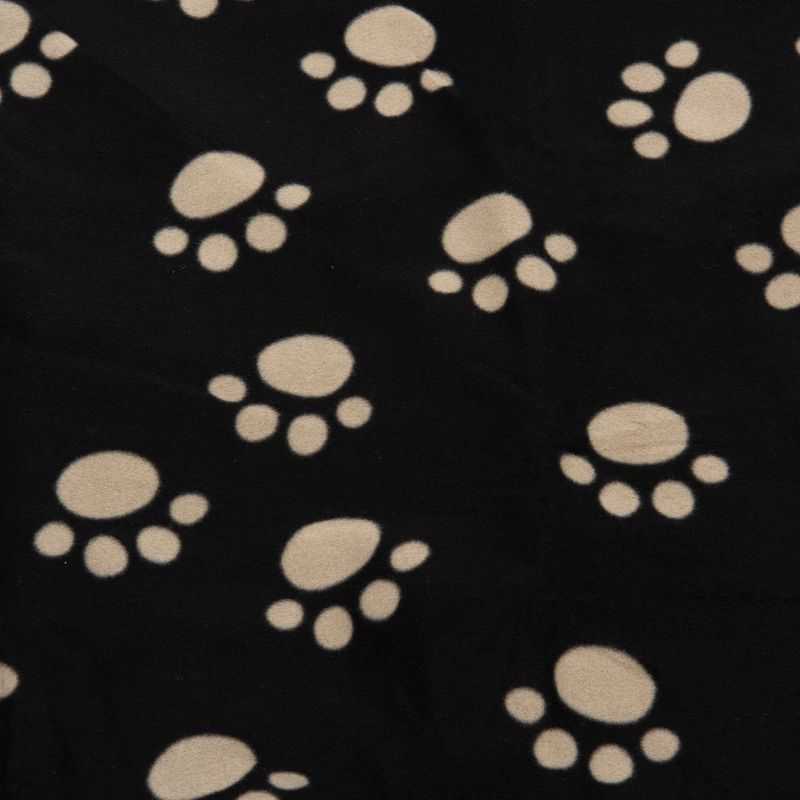 Black fabric with beige paw print pattern.
