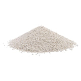Pile of white, fine-grained material, possibly cat litter or similar product.