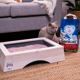 Tray filled with litter beside a bag labelled Sanicat, showing product in use and packaging together.