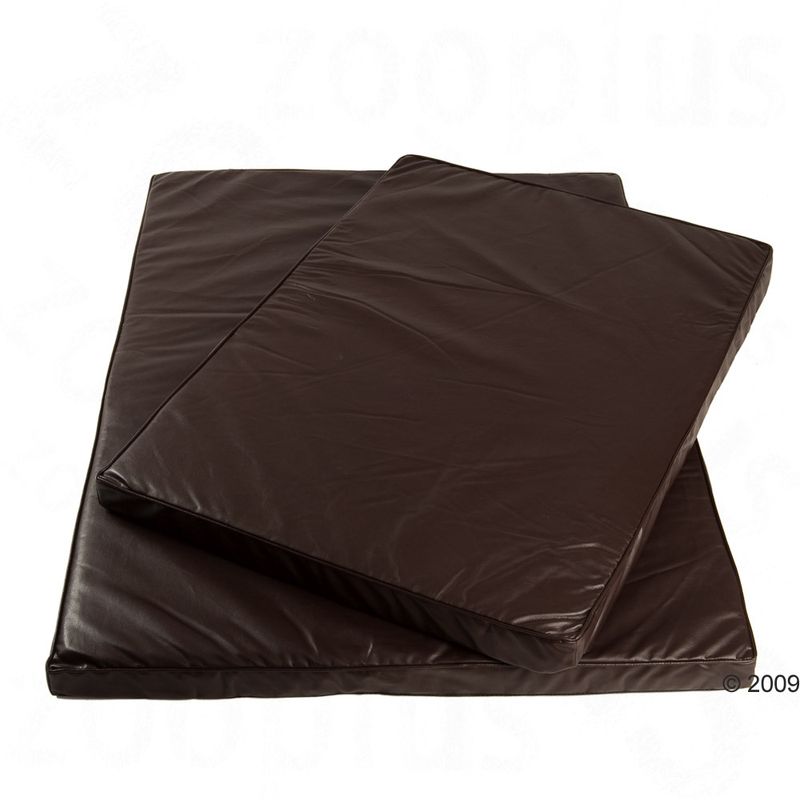 Two brown, rectangular mats made of smooth material, stacked on top of each other.