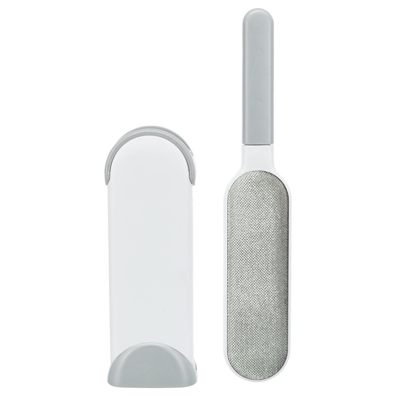 Lint brush with grey handle and white storage case, suitable for removing pet hair.