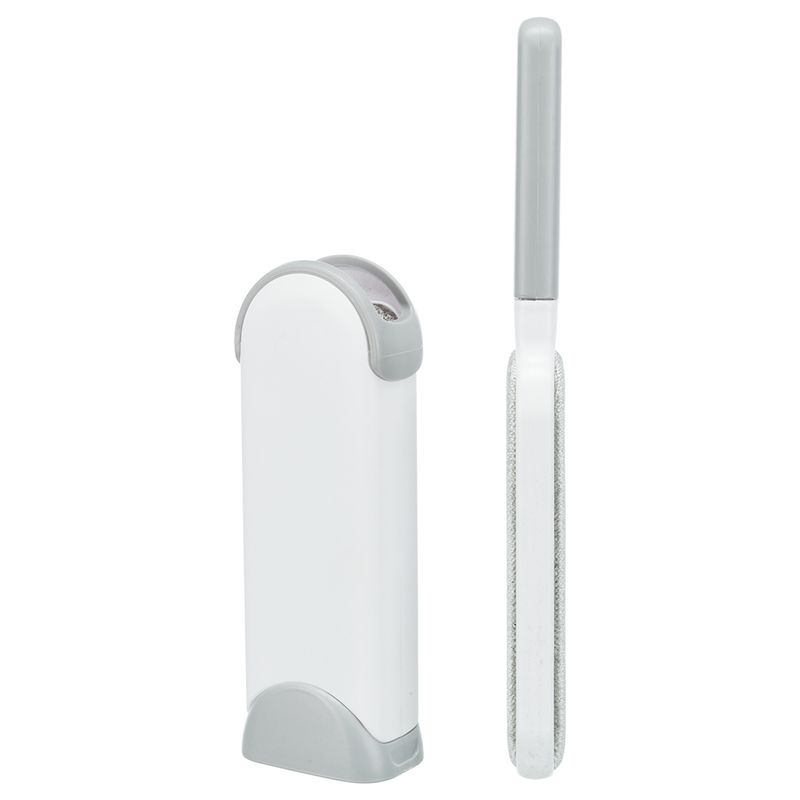 Lint brush with grey handle and white cleaning station, suitable for removing pet hair from clothing and furniture.