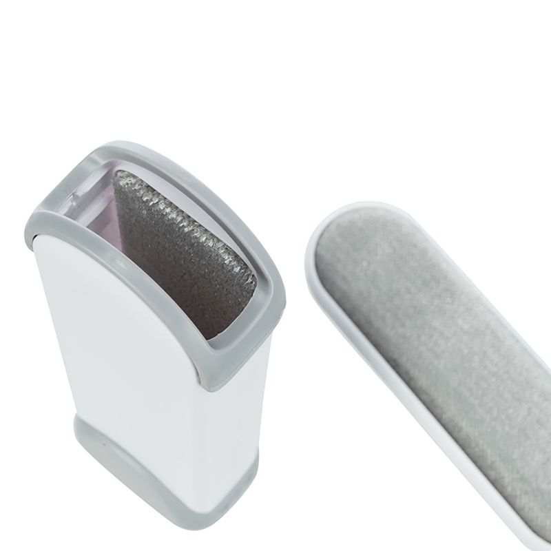 Grey and white lint brush cleaner with removable brush, suitable for removing pet hair.