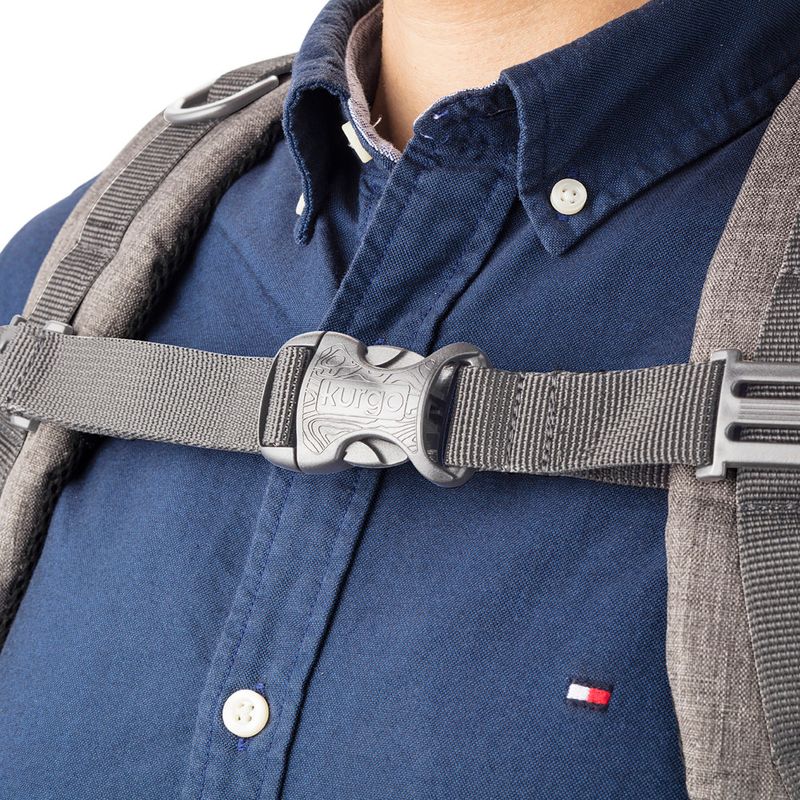 Kurgo chest harness with click fastener, grey material, worn over a blue shirt.