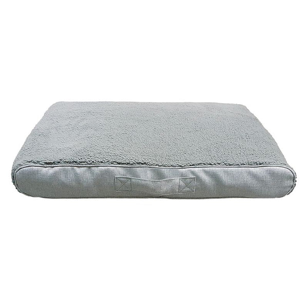 Grey rectangular pet cushion with soft surface and carrying handle on the side.