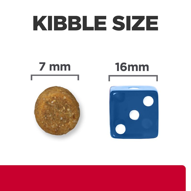 Kibble size comparison showing a 7mm round kibble next to a 16mm blue die for scale.