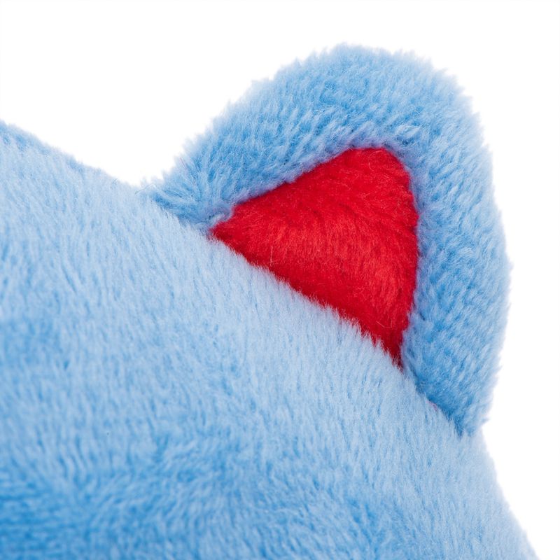 Close-up of a plush toy with blue fur and red inner ear.