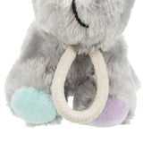 Grey plush toy with a mint green and purple paw and a white rope ring as a handle.
