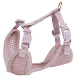 Pink harness made of breathable mesh fabric with adjustable straps and click fasteners, visible metal ring for attachment.