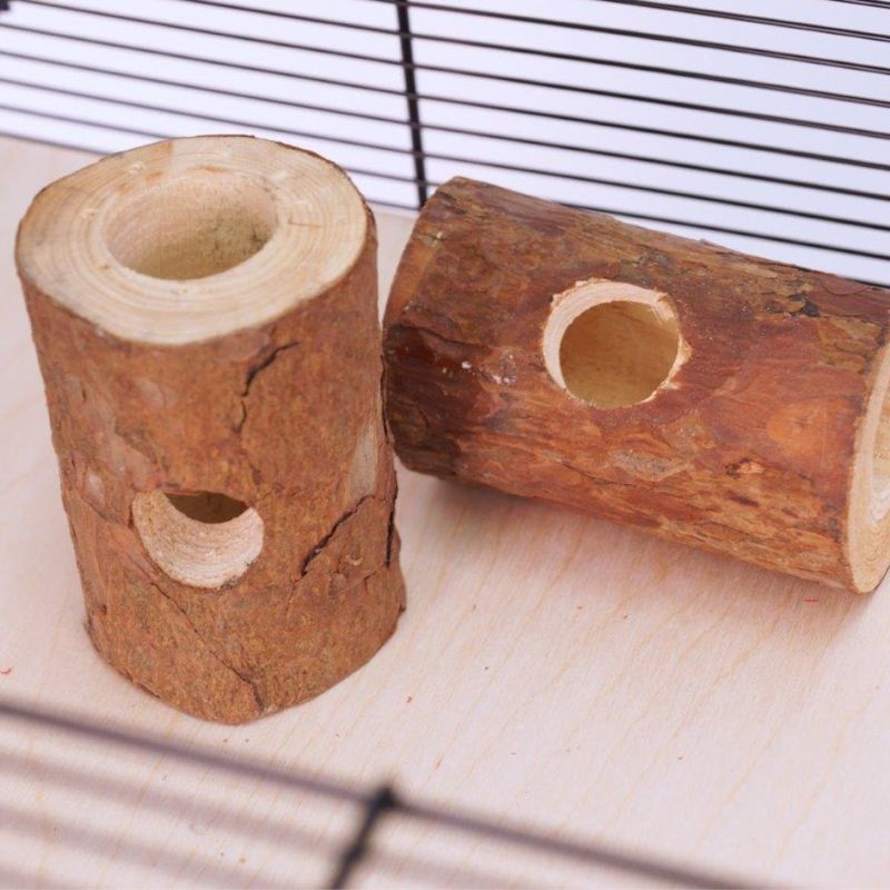 Two wooden tunnel toys with holes, placed inside a cage on a light surface. Designed for small animals to explore or chew.
