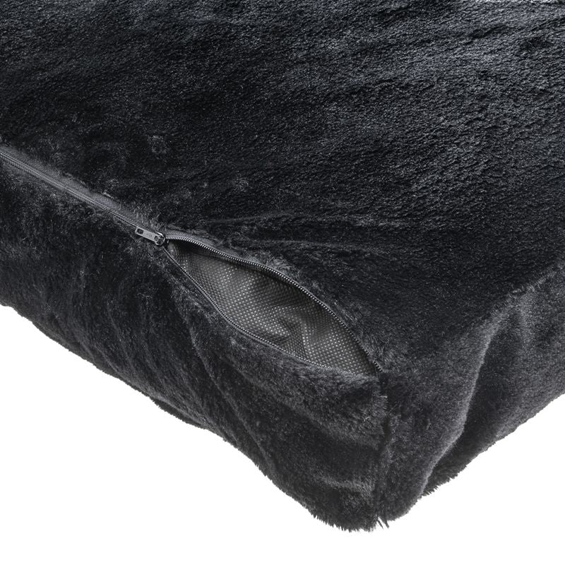 Black cover made of soft plush with visible zip and non-slip underside.