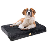 Black dog cushion with soft surface and rectangular shape, visible brand label on the side.