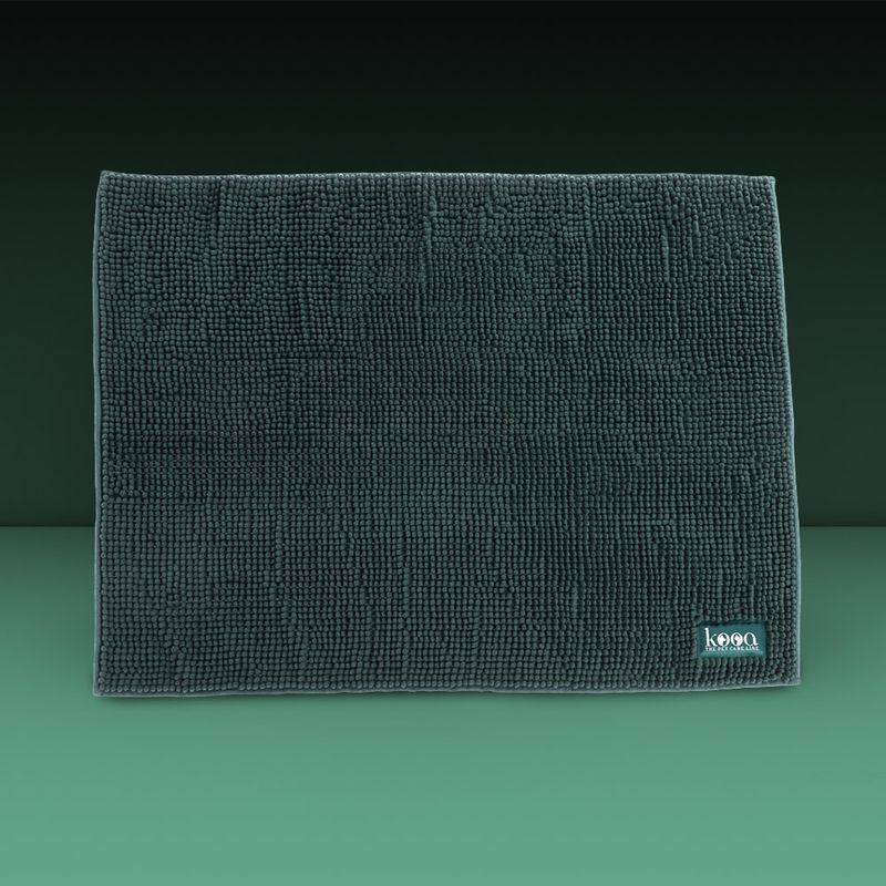 Dark green mat with microfibre texture, rectangular, 'kooa' brand logo visible at bottom right.