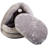 Grey, cave-shaped pet bed with removable soft cushion and hanging pompom toy.