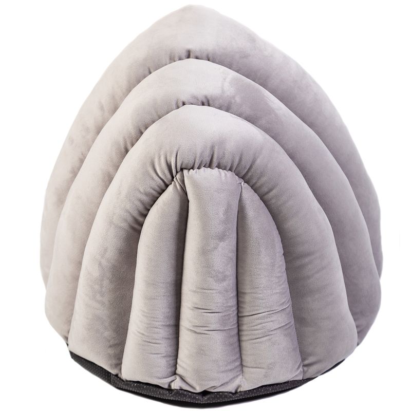 Grey, padded pet bed in a shell-like shape with a soft surface and black base.