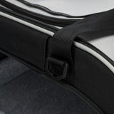 Close-up of a black strap with D-ring and zip on a product, possibly a bag or carrier.