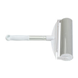 Lint roller with white handle and grey adhesive roll, suitable for removing pet hair and dust.