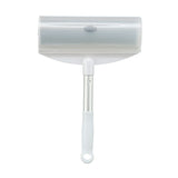 Trixie lint roller with white handle and metal shaft, suitable for removing pet hair.
