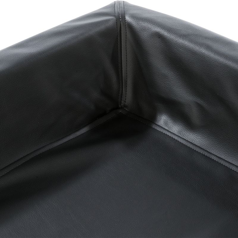Close-up of a black, smooth leather surface with stitching at the corner. Material details for product description.