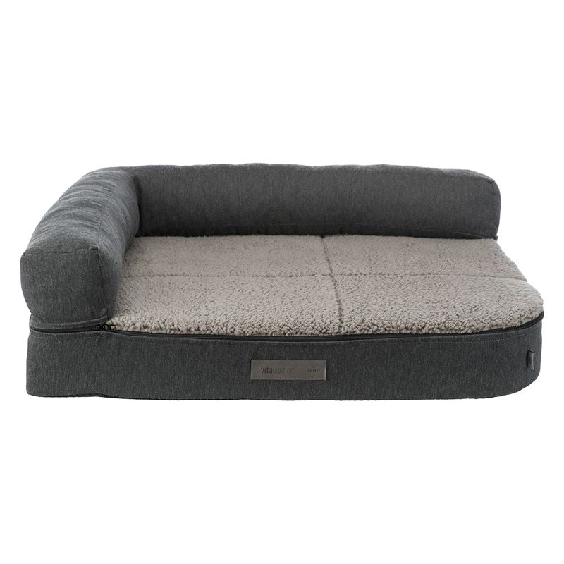 Grey pet bed with soft beige lying surface and raised edge. Label visible: vitalEdition Revive.