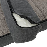 Close-up of a grey dog bed with removable cover and zip, showing inner padding.