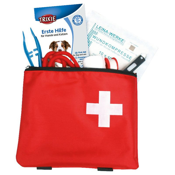 First aid kit for dogs and cats by Trixie, includes wound compress, tweezers and bandages in a red bag with white cross.