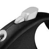 Close-up of a black handle with two silver control buttons, presumably for a retractable dog lead.