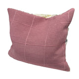Pink cushion with square pattern and textured surface, suitable for decoration or comfort.
