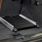 Transport platform made of aluminium and non-slip material, installed in the boot of a car.
