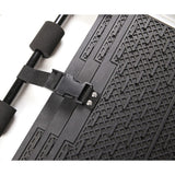 Black non-slip mat with grid pattern, adjustable strap and foam padding. Brand name Rotrax visible on the surface.