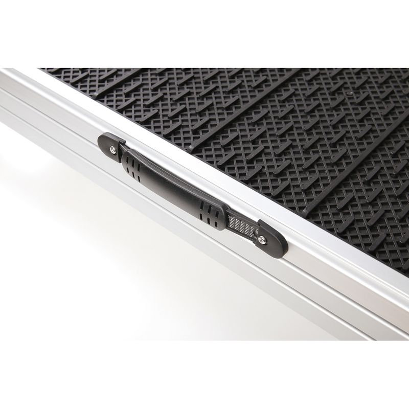 Close-up view of an aluminium ramp with non-slip black surface and carrying handle.
