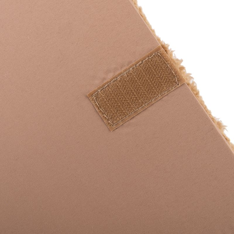 Close-up of a brown hook-and-loop fastener on fabric material, showing the product's fastening option.