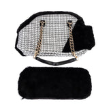 Black carrier bag with faux fur and gold chains, including removable faux fur cushion.