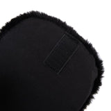 Close-up of black, fluffy material with hook-and-loop fastener. Product detail view.