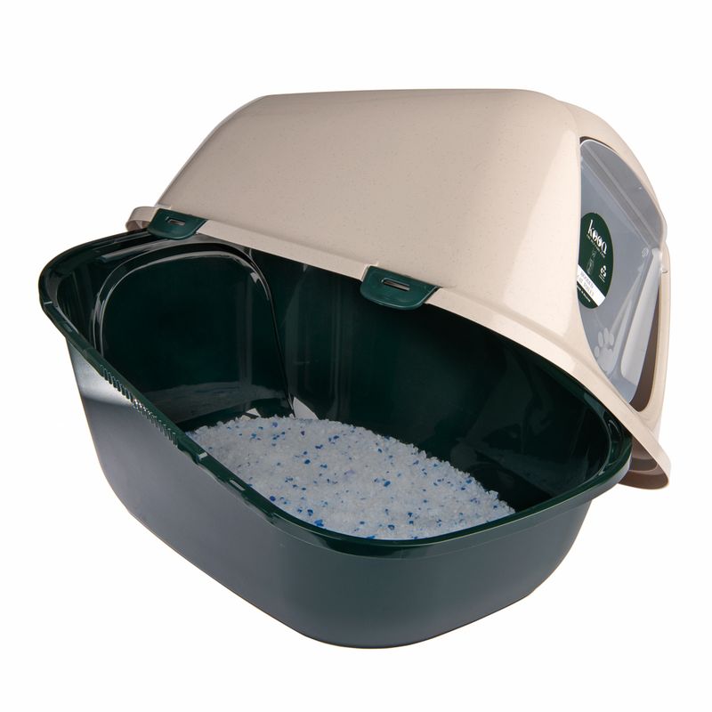 Closed cat toilet with green base, beige lid and viewing window. Litter with blue granules visible inside.