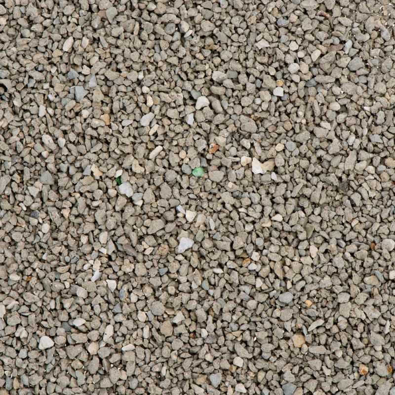 Close-up view of grey, granular material showing the texture and size of the product's small, irregular pieces.