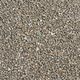 Close-up view of grey, granular material showing the texture and size of the product's small, irregular pieces.