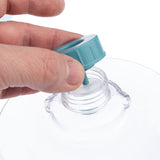 Hand showing how a turquoise lid is screwed onto a transparent bottle.